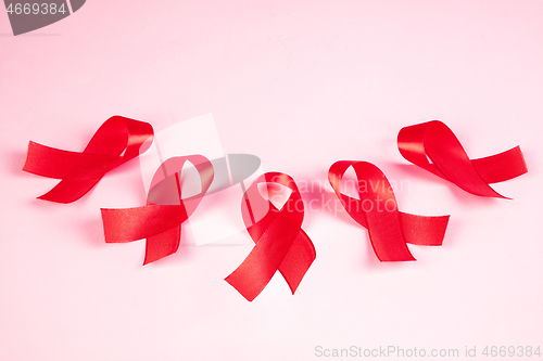 Image of Aids Awareness Sign Red Ribbon. World Aids Day concept.