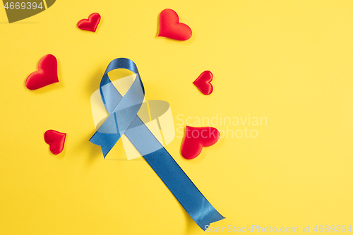 Image of Blue ribbon symbolic of prostate cancer awareness campaign and men\'s health in November