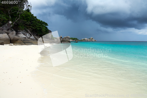 Image of White sand beach and storm sky