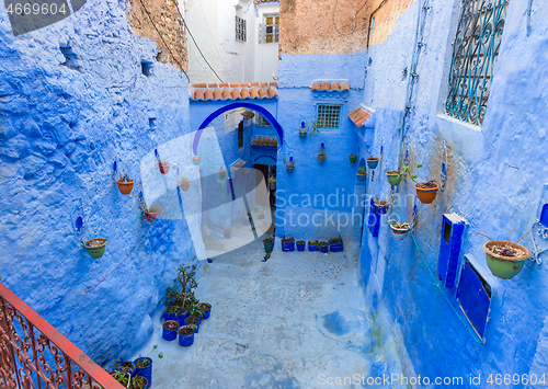 Image of Blue street with color pots in Chefchaouen