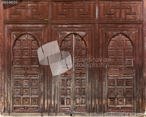 Image of Old three wooden doors in Morocco