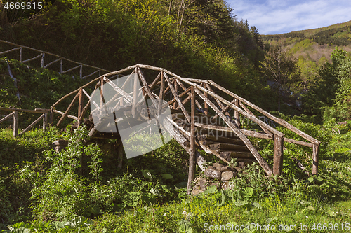 Image of old weathered wooden bridge