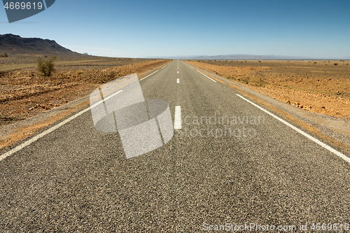 Image of Asphalt road in a rocky desert