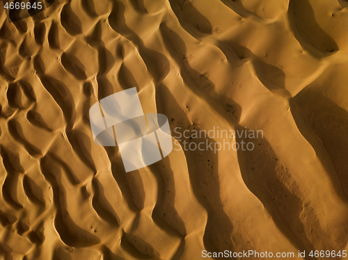 Image of Aerial top view on sand dunes in desert