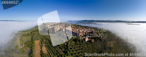 Image of Old Italian city on top of hill in fog