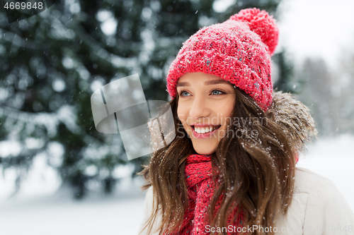 Image of smiling teenage girl outdoors in winter