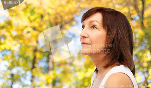 Image of portrait of senior woman in autumn