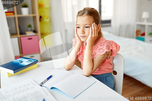 Image of sad student girl with notebook at home