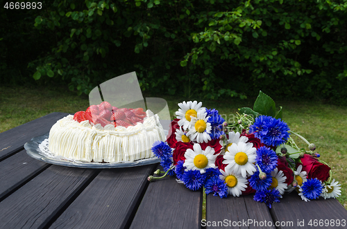 Image of Bouquet summer flowers and a cream cake