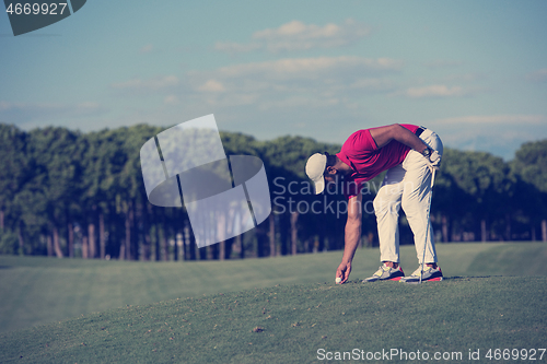 Image of golf player hitting long shot