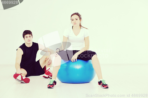 Image of happy young couple fitness workout and fun