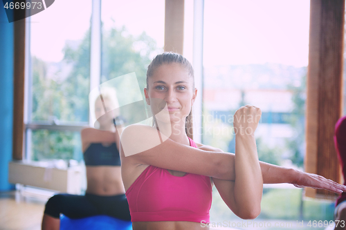 Image of group of people exercise with balls on yoga class