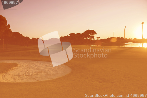 Image of golf course on sunset