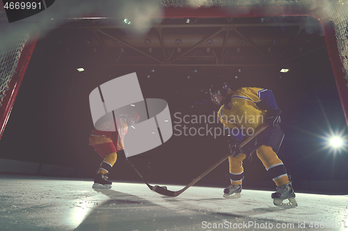 Image of teen ice hockey sport  players in action