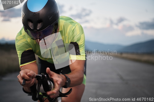 Image of triathlon athlete riding a bike