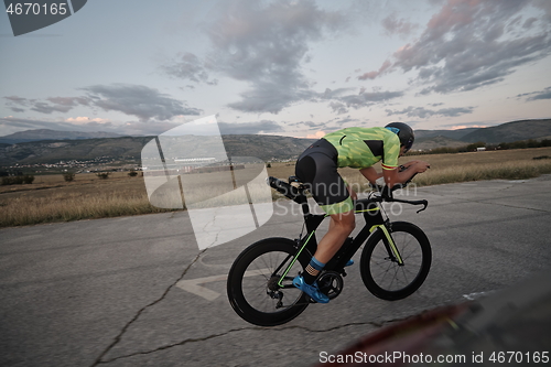 Image of triathlon athlete riding a bike