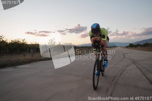 Image of triathlon athlete riding a bike