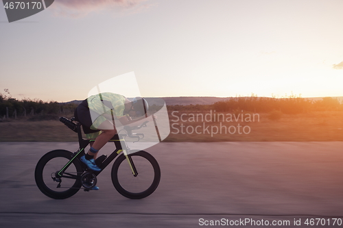 Image of triathlon athlete riding a bike