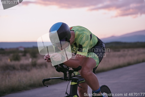 Image of triathlon athlete riding a bike