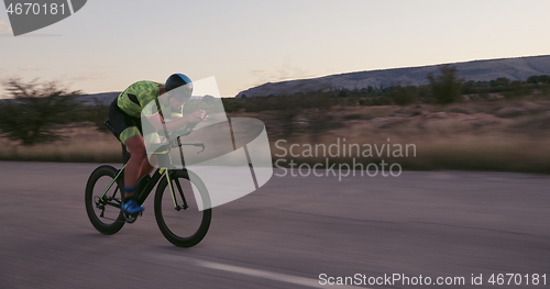 Image of triathlon athlete riding a bike