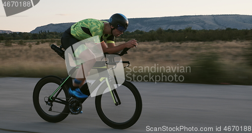 Image of triathlon athlete riding a bike