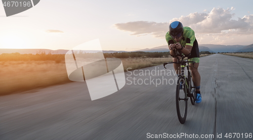 Image of triathlon athlete riding a bike