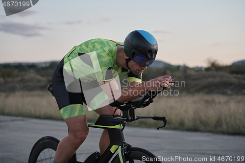 Image of triathlon athlete riding a bike