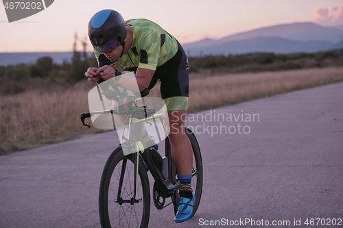 Image of triathlon athlete riding a bike