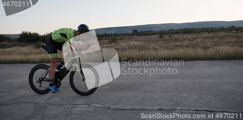 Image of triathlon athlete riding a bike