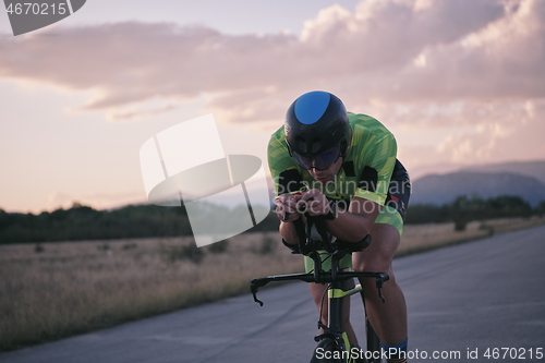 Image of triathlon athlete riding a bike