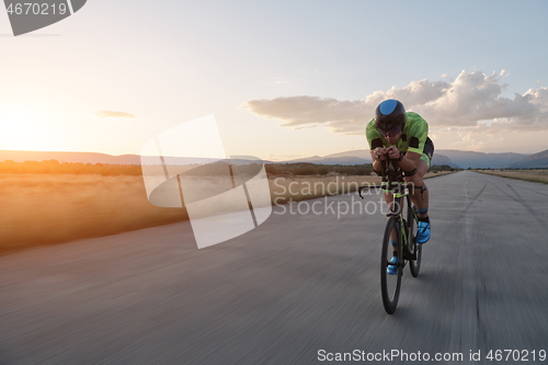 Image of triathlon athlete riding a bike