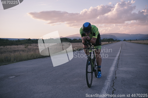 Image of triathlon athlete riding a bike