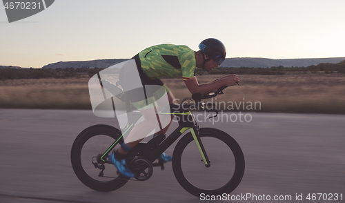 Image of triathlon athlete riding a bike