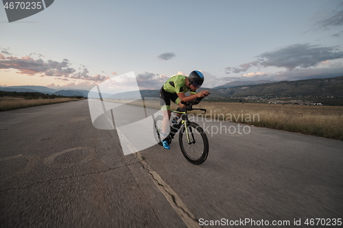 Image of triathlon athlete riding a bike