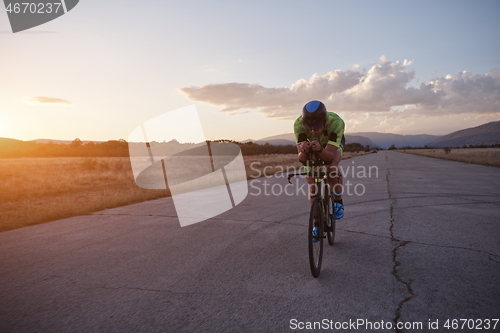 Image of triathlon athlete riding a bike