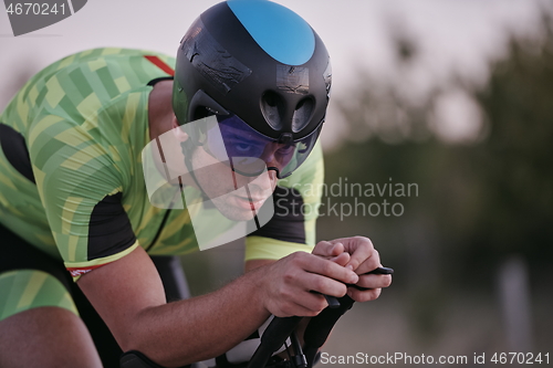 Image of triathlon athlete riding a bike