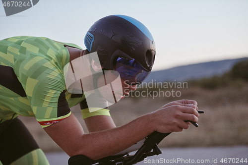 Image of triathlon athlete riding a bike