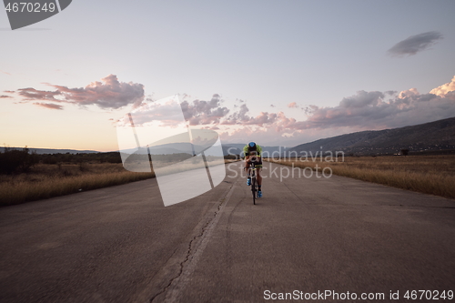 Image of triathlon athlete riding a bike