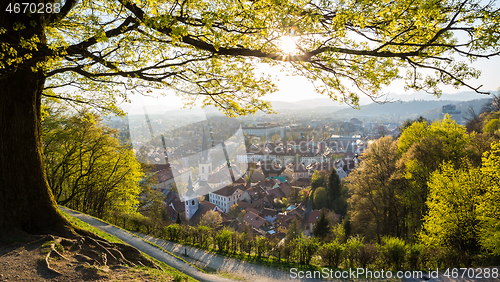 Image of Panoramic view of Ljubljana, capital of Slovenia. Roooftops of Ljubljanas old medieval city center seen from Ljubljanas castle park at sunset