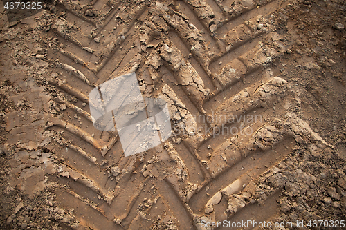 Image of tire footprints on the ground