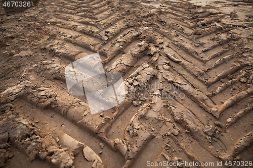 Image of tire footprints on the ground