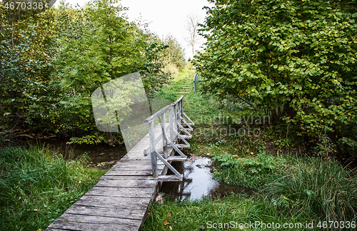 Image of wooden footbridge across the river