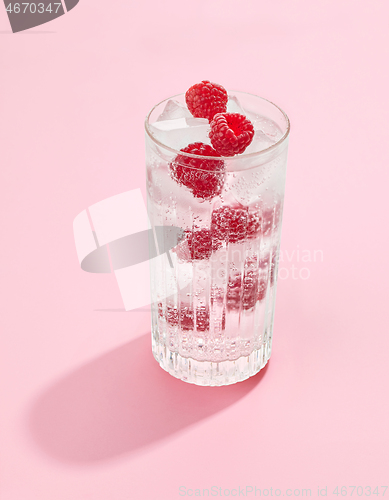 Image of glass of raspberry soft drink