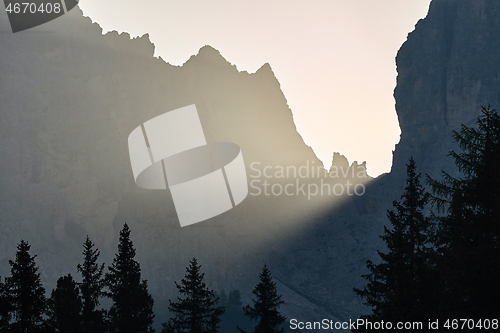 Image of Sunrise between mountain cliffs