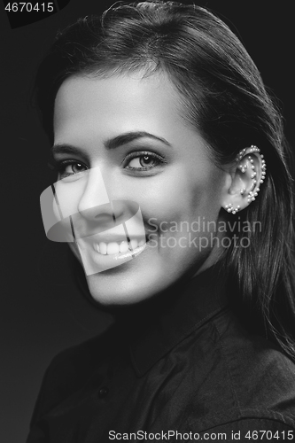 Image of Beautiful girl with pearls on ear