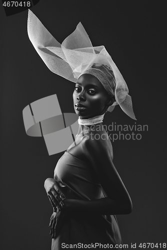 Image of Beautiful african girl with veil hat