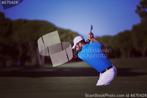 Image of pro golfer hitting a sand bunker shot