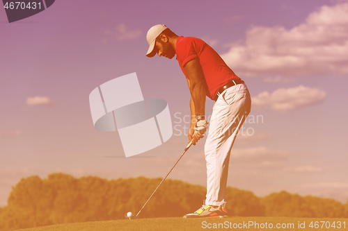 Image of golf player hitting long shot