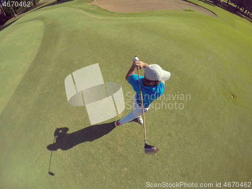 Image of top view of golf player hitting shot