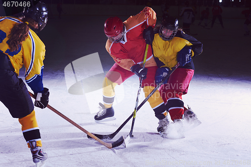 Image of teen ice hockey sport  players in action